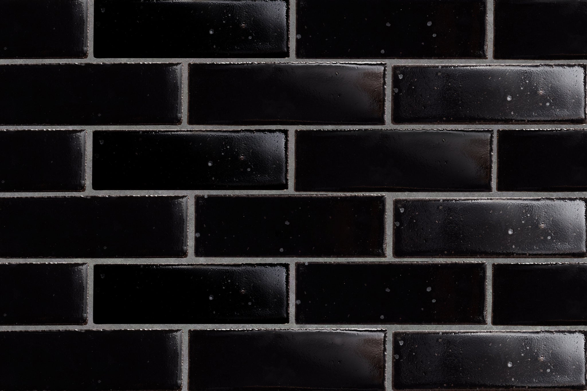 CA21728_cle-tile-brick-guild-fundamentals-2x8-gloss-black-wall.jpg