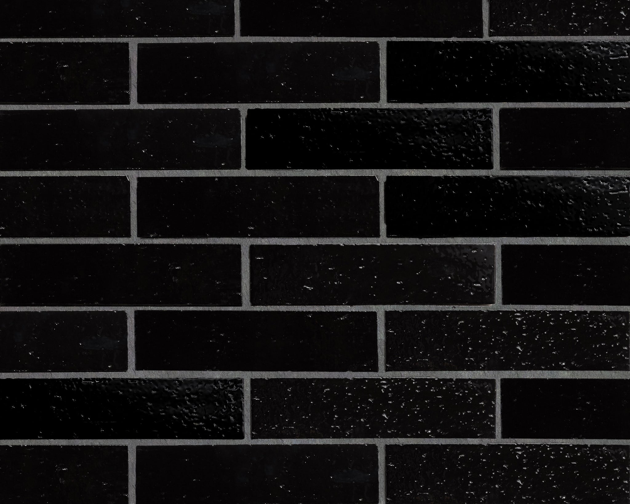 GB11075-cle-tile-brick-modern-farmhouse-2x8-black-gloss-brick wall.jpg