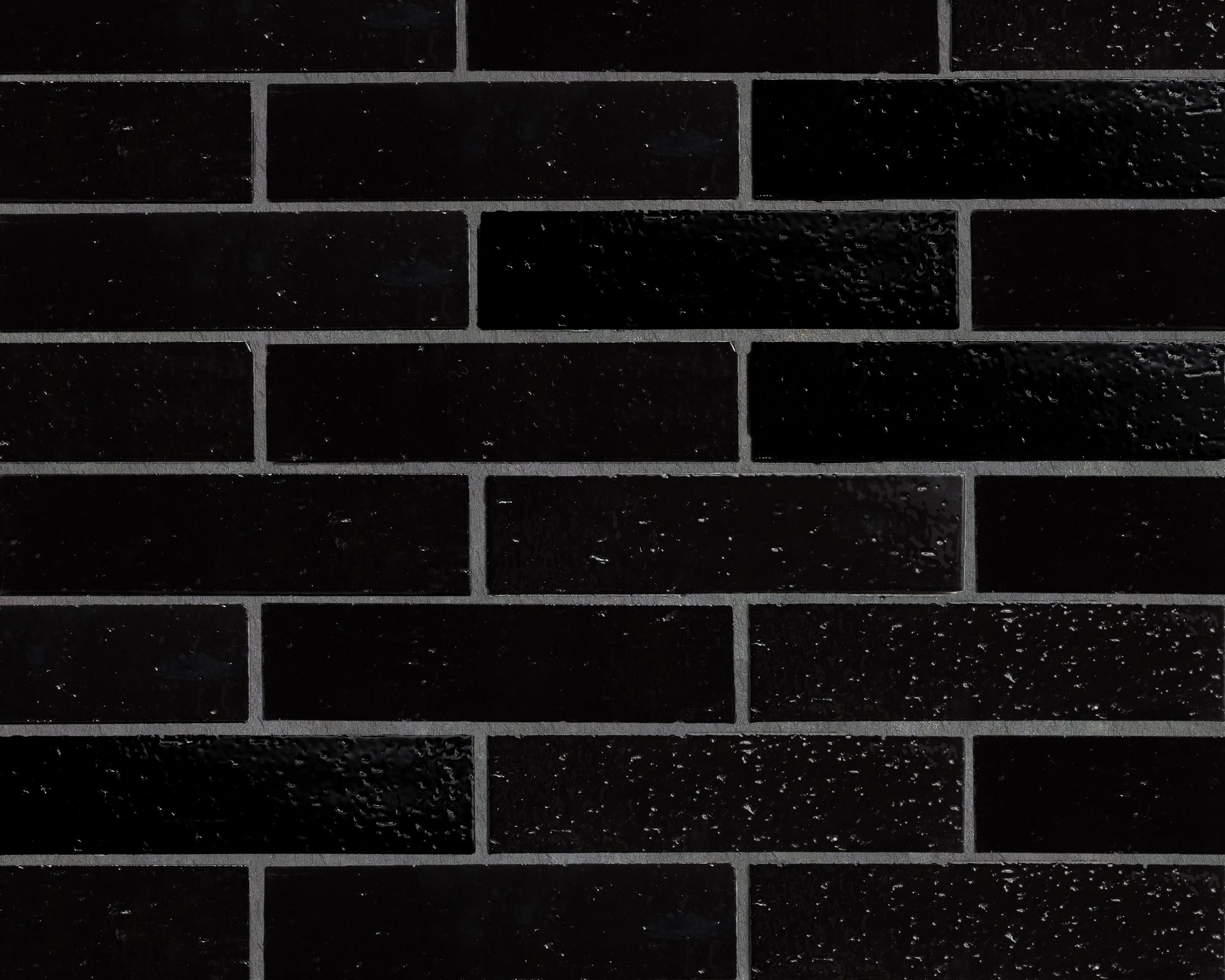 GB11075-cle-tile-brick-modern-farmhouse-2x8-black-gloss-brick wall.jpg