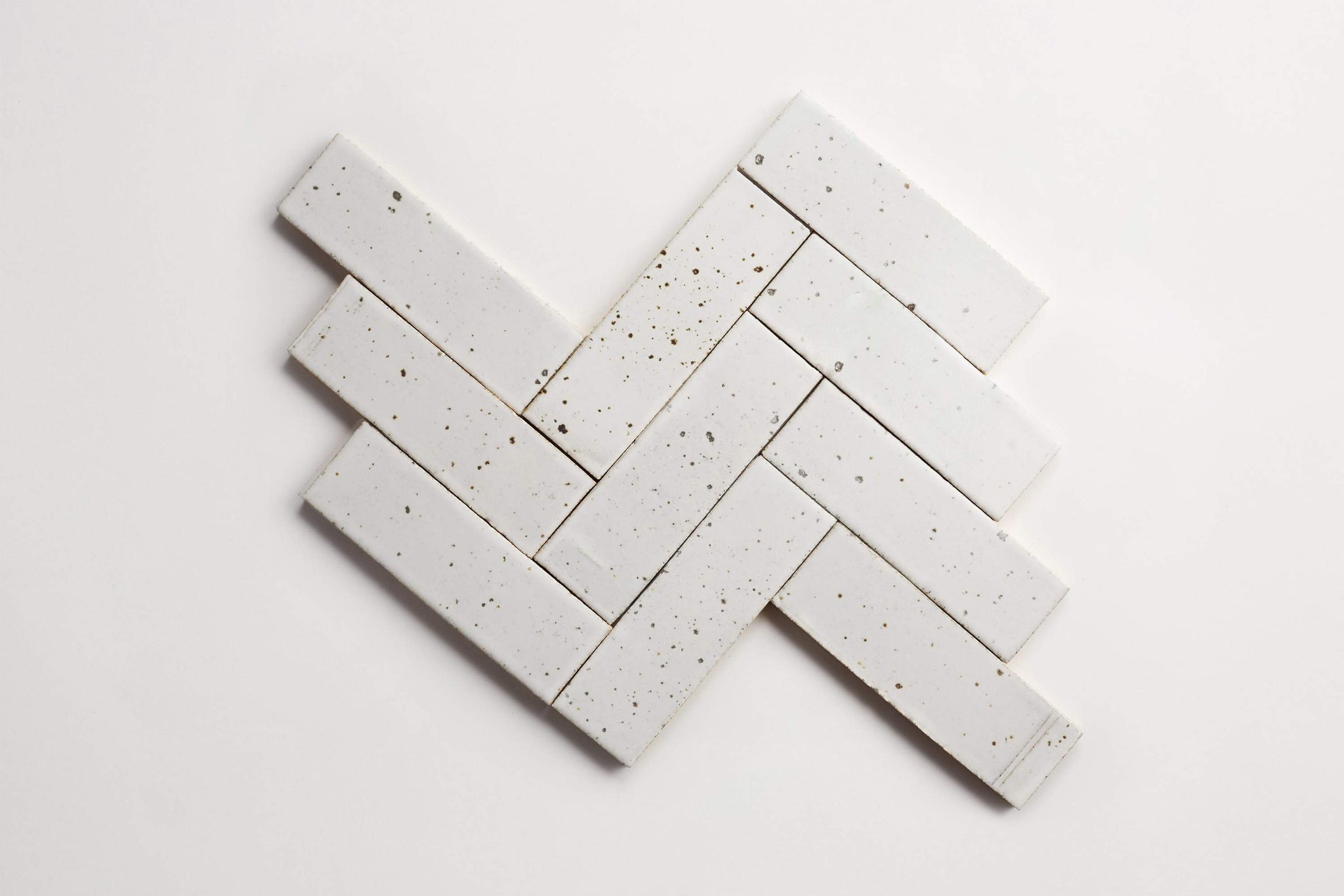 ca21725_cle-tile-brick-guild-fundamentals-2x8-matte-white-herringbone-v1-lines2.jpg