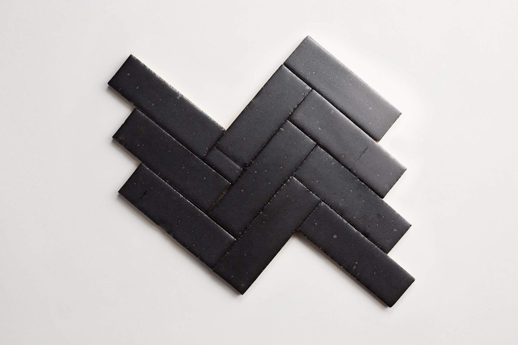 ca21727_cle-tile-brick-guild-fundamentals-2x8-matte-black-herringbone-lines2.jpg