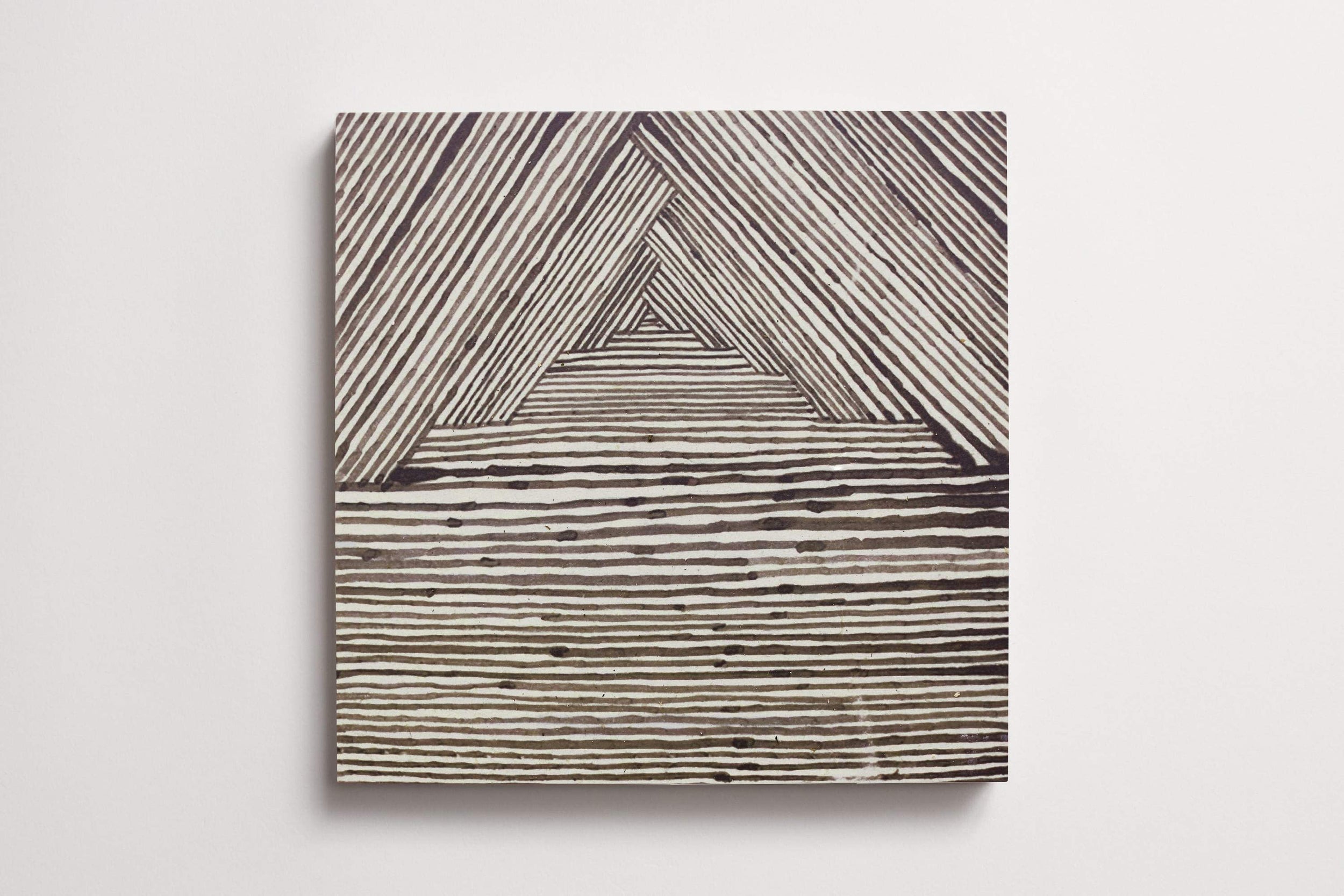 cle_tile_limestone_ruan_hoffmann_mlm_charcoal_triangle_texture_pks_square_12x12_3.0.jpg