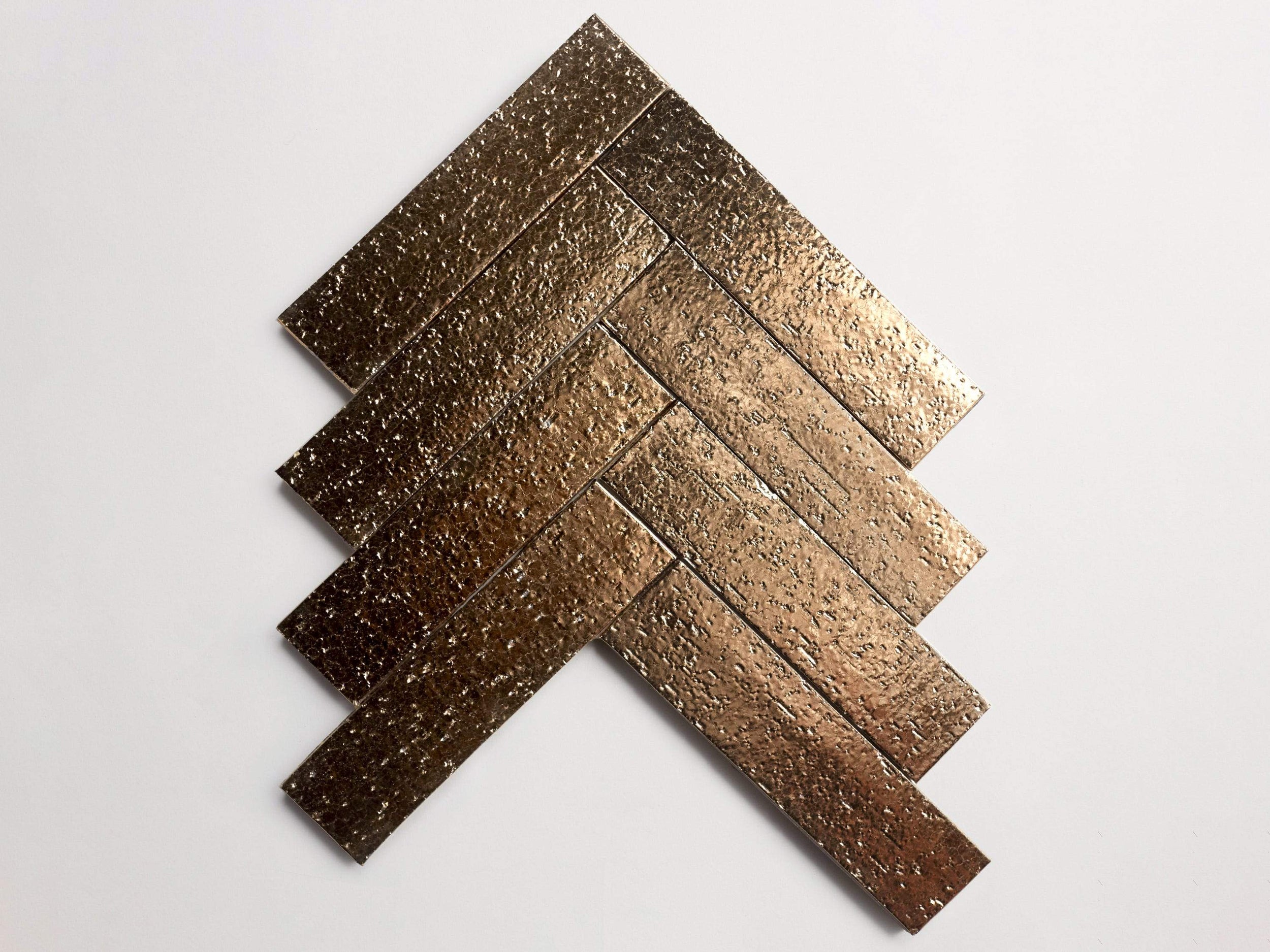 gb12004_cle_tile_mfb_bronze_gloss_herringbone_2.5x9.5_overhead_main_3000x2250_56de2011-3d77-4511-bafa-50a0364c9c89.jpg