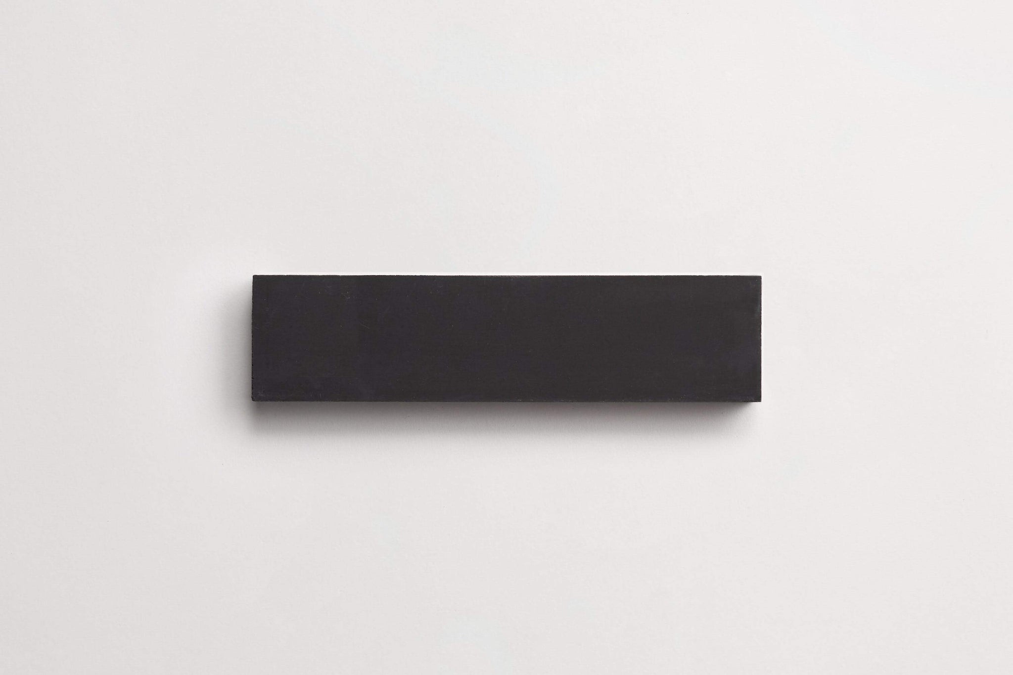 cement | solid | black | rectangle ~ 2"x8"x0.625"