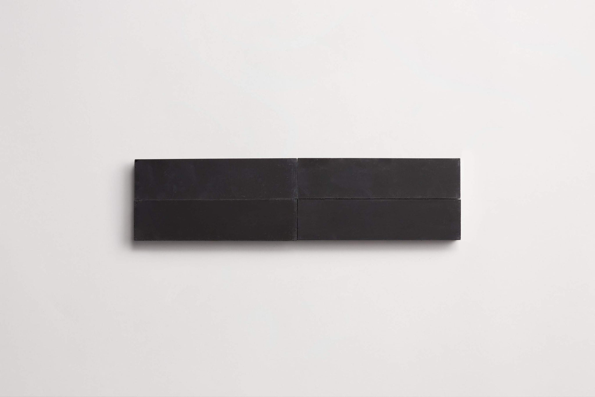 cement | solid | black | rectangle ~ 2"x8"x0.625"