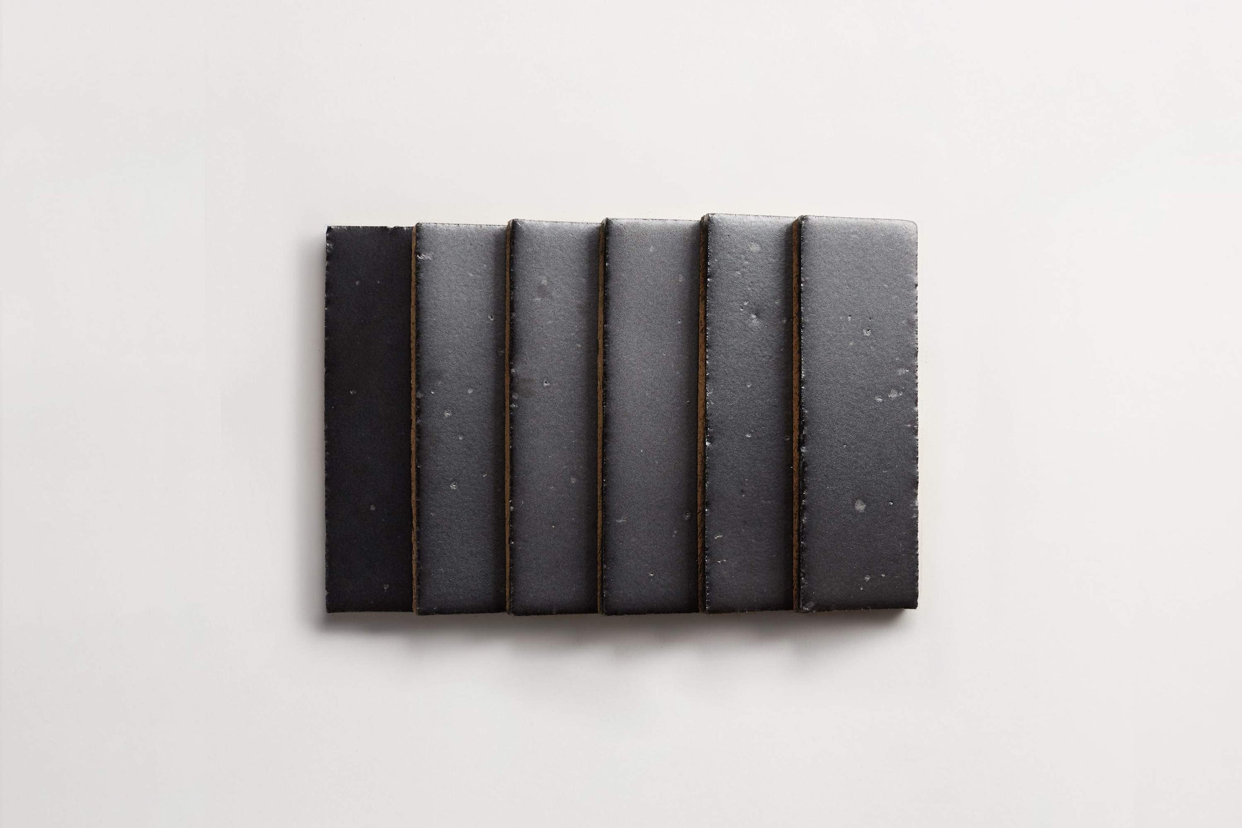 ca21727_cle_tile_brick_foundations_matte_black_2.5x8_overhead_main_stack_3600x2400_82a9986e-6302-4efa-88da-347259826301.jpg